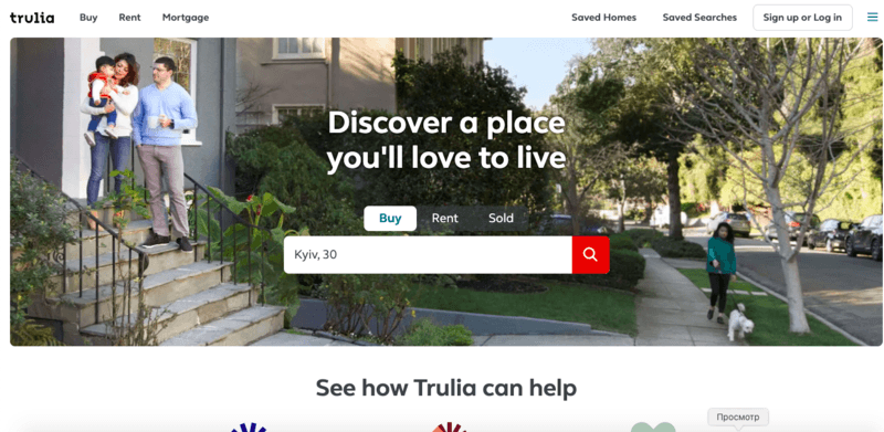 Trulia homepage featuring a family on a house's front steps, with options to search for homes in Kyiv and navigate between 'Buy,' 'Rent,' and 'Mortgage' sections.