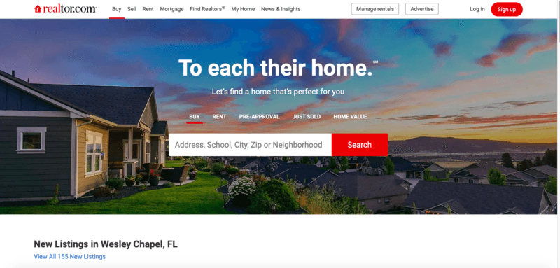 Realtor.com homepage featuring a scenic house with options to search for homes by address, school, city, zip code, or neighborhood.